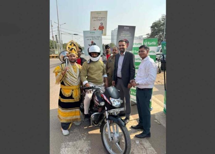 Fortis helmet safety drive, road safety campaign India, Fortis Healthcare initiative, traffic police partnership, helmet distribution India, Fortis Hai Na campaign,Fortis Hospital